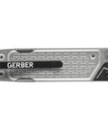 Lockdown Driver 7 In 1 EDC Multitool With A 2.5 Inch Plain Edge Blade, Scissors, Bit Driver, File, Chisel, Awl And Replaceable Knife Blades