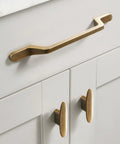 12 Pack 3 Inch Large Oval Antique Brass Cabinet Drawer Pulls For Dresser Cupboard Wardrobe With Single Hole Mount shown on white cabinets.
