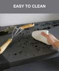 Cleaning the Built Tough 42 Inch Plastic Resin Four Tier Shelving Rack surface with a cloth to showcase easy clean solid panels.
