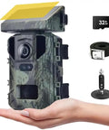 Hand holding Beast Mode Mini Solar Trail Camera with camouflage design and solar panel for wildlife monitoring.