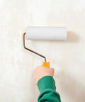 Hella Durable Small Paint Roller Sponge Sleeves For Trim And Cabinet Painting White Foam Covers in use on a wall.