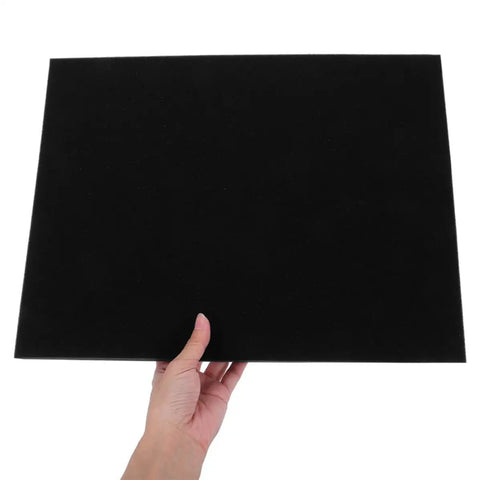 Hand holding black Protective Foam Padding Sheets For Shipping Electronics Glassware And Small Business Packaging Flexible Cushion Inserts