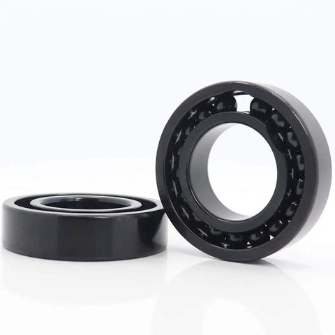 Pro Spec High Temperature Ball Bearing Tb6014 Heavy Workhorse Power Transmission Component Built Dang Tough For Roasting Engines And Rough Industrial Driveshaft Gearboxes, two black ball bearings.