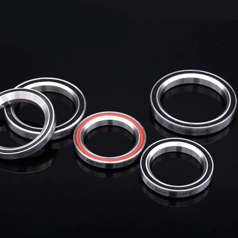 Sturdy Bicycle Headset Bearing Repair Kit For Mountain Bike With Beefy Steel Upper Bearing. Various steel fork cups displayed.