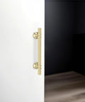 10 Pack 5 Inch Brushed Gold Cabinet Handles Premium Aluminum Zinc Alloy on white cabinet door for kitchen use.