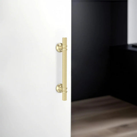 10 Pack 5 Inch Brushed Gold Cabinet Handles Premium Aluminum Zinc Alloy on white cabinet door for kitchen use.
