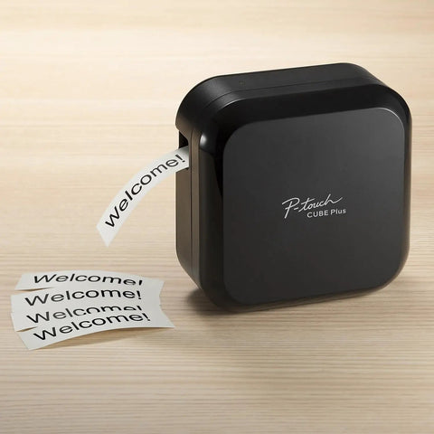 P-Touch CUBE Plus Bluetooth Label Maker PT-P710BT Portable Label Printer, black, printing Welcome label, on wooden surface