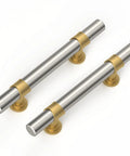 Solid Cabinet Pulls And Drawer Handles 10 Pack Featuring Smooth Brushed Nickel Finish With Straight Up Gold Accents close up of two handles.