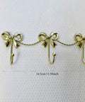 Kickass Heavy Duty Wall Mounted Coat Hook Bulletproof Metal Clothes Hanger with three hooks and decorative bows, 34.5cm.