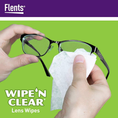 Close-up of hands wiping glasses with Flents Wipe 'N Clear lens wipes; pre-moistened, individually wrapped