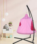 Pink X Shaped Hanging Tree Tent With Swing Chair And Stand Patio Canopy in a living room setting.