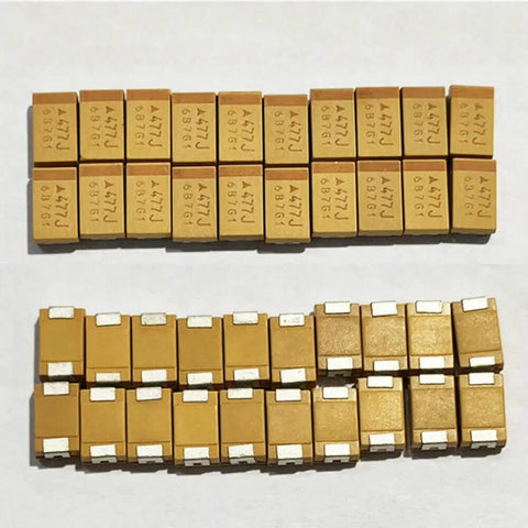 Twenty Pack Of Pro Grade Tantalum Capacitors Brings Serious 470 UF And 6.3 Volt Juice To Your Rig For Smooth Smd 7343 Circuit Mods And Everyday Gear Upgrades. SMD 7343 tantalum capacitors arranged in two rows.