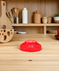 Tough Plastic Smoke Alarm Covers Four Pack Waterproof Dust Protector Shield Keep Kitchen Detectors Spotless Hassle Free Easy Snap On Grease Guard For Busy Kitchens, red cover on wooden kitchen countertop.