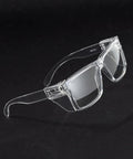 Photochromic Safety Glasses Featuring Blue Light Blocking Armor And Scratch Resistant Glass, clear frame, angled view.