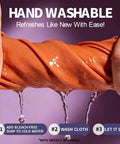 Close-up of orange microfiber lens cleaning cloth being wrung under water