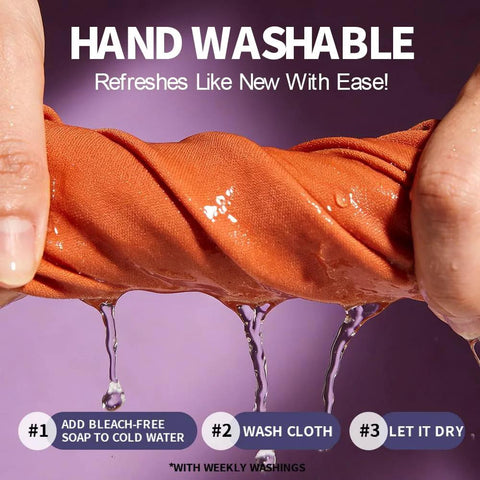 Close-up of orange microfiber lens cleaning cloth being wrung under water
