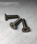 Tough As Nails GR2 Titanium Hex Socket Countersunk Flat Head Screws Yield Smoother Fit With Tight Metric Fine Threads And Rock Solid Protection For Heavy Lift Aerospace Medical Builds In Precise M8 By Forty Five Millimeter Specs Sold Per Box, three screws displayed on a surface.