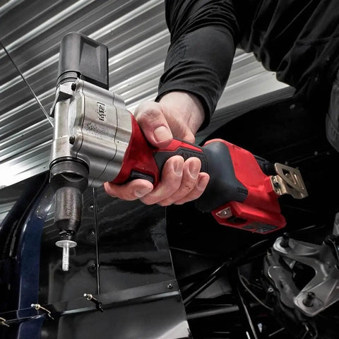 Killer Grade Cordless Rivet Tool Fits Milwaukee M12 12V Systems in hand, applying metal fasteners with precision.
