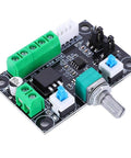 Stepper motor controller board with black PCB, green screw-terminal blocks, blue trim pots, and metal shaft knob.