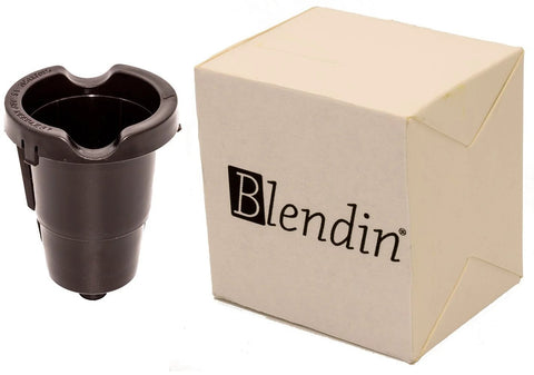 Front view of Blendin replacement K-Cup pod holder with exit needle, black plastic, beside beige box.