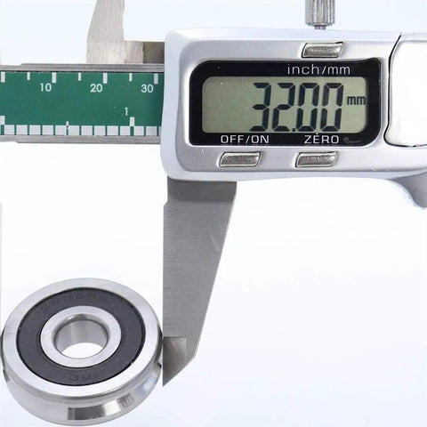 Built Tough V Groove Sealed Ball Bearings Precision Crafted 10 X 32 X 9 mm being measured at 32mm with calipers for precise sizing.