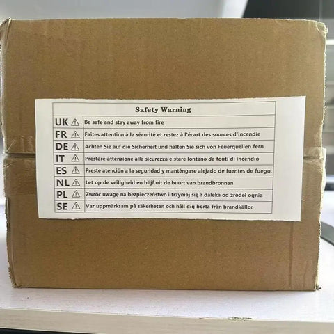 Safety warning label on a cardboard box for Multi Exercise Flywheel Trainer With Adjustable Resistance For Beast Mode Full Body Strength Workouts And Smash Muscle Gains At Home Legit Fitness Gear That Builds Serious Endurance.