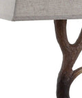 Close-up of rustic 29.5 inch antler table lamp with light grey linen shade on faux resin base for cabin decor.
