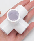 Hand holding 4 Pack 1/2 Inch PVC Fittings 4 Way Elbow Connector Furniture Grade For DIY Shelving and Storage Frames