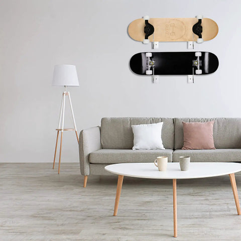 4 Pack Premium Clear Acrylic Skateboard Wall Mount Racks Heavy Duty Display Hooks For Longboard Snowboard And Deck Gear Keep The Floor Clear Sick Room Setup with two skateboards displayed in a stylish living room.