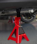 Rugged Steel Jack Stands Pair Offering 3 Ton 6000 Pounds Capacity under vehicle, showcasing sturdy support in garage setting.