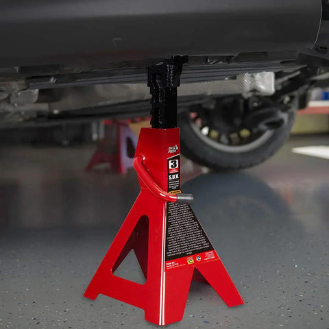 Rugged Steel Jack Stands Pair Offering 3 Ton 6000 Pounds Capacity under vehicle, showcasing sturdy support in garage setting.