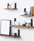 Heavy Duty Black L Shelf Brackets Four Pack Rustic Iron Floating Shelf Supports With Durable Powder Coat showcasing mounted shelves with decor items.