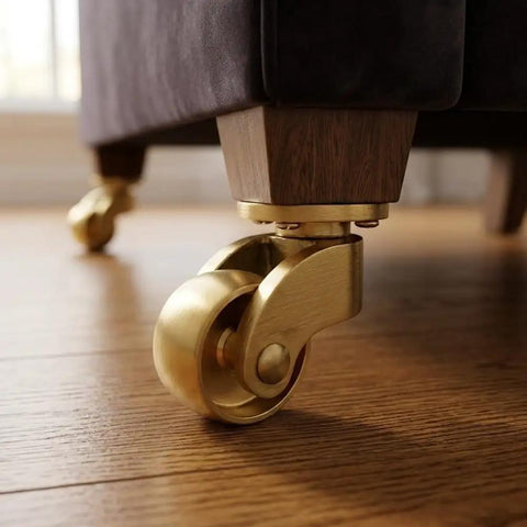Heavy Duty Brass Casters Four Pack Double Ball Bearing Furniture Wheels Rust Resistant with smooth rolling design on wood floor.