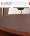 Premium Heavy Duty Lazy Susan Rotating Turntable Serving Tray For Kitchen Counters And Backyard Bashes With Ridiculously Smooth Spin And Zero Hassle Dinner Setup on a thick solid wood table top.