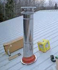 Red Silicone High Temperature Pipe Flashing With 11 Inch Square Base Fits 3 To 7 Inch Outside Diameter Pipe installed on metal roof