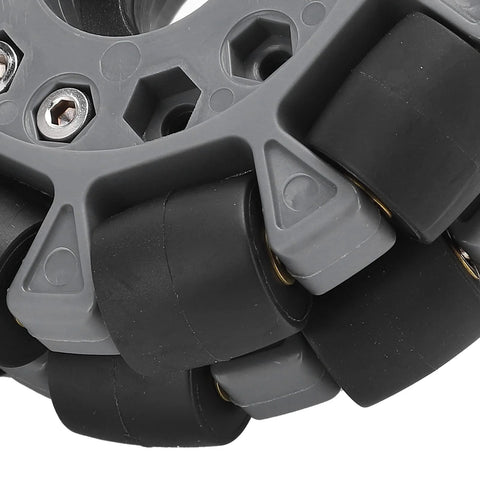 Close-up of a 100mm omnidirectional robot wheel with durable rubber rollers for tight-space maneuvering and 20 kg load capacity.