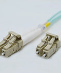 Om4 Lc To Lc Fiber Patch Cable 10Gbps Duplex Multimode 50 By 125 Micron 10 Meter with beige connectors for seamless data transfers.