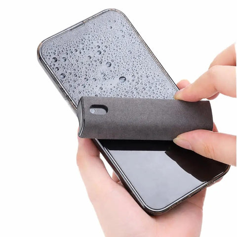 2 Pack Car And Device Screen Cleaner Spray And Wipe 2 In 1 Touchscreen Mist Cleaner For iPhone iPad Laptop MacBook And More With Microfiber Cloth Streak Free Fingerprint Remover Grey And Rose Gold being used on a smartphone screen