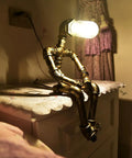 Steampunk Table Lamp With Robot Pipe Design In Bronze Industrial Desk Light For Office Bedroom And Living Room Vintage Retro Dope Loft Style Space That Adds A Cozy Industrial Glow For Any Room. Unique sitting robot design on a bedside table.