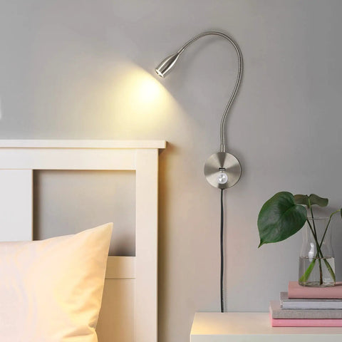 Dimmable LED Wall Reading Light With USB Charging Port For Late Night Reading And Work Gooseneck Bedside Lamp With Flexible Arm 3W Nickel Finish 120V Plug In Warm White Glow mounted beside bed and plant on nightstand