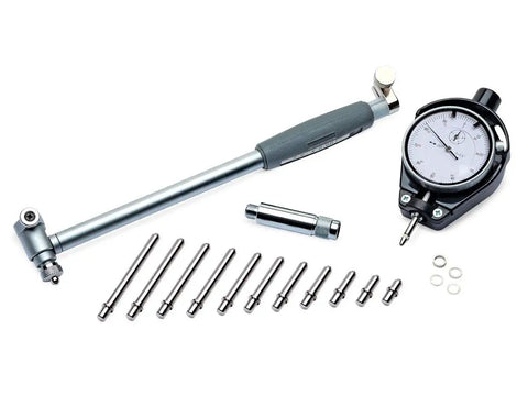 Pro Shop Dial Cylinder Bore Gauge Kit Engine Bay Essential Measures Two To Six Inches With A Thou Readout, featuring polished steel tools.