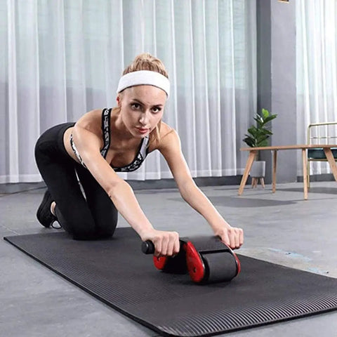 Woman using the Shred Your Abs and Build a Solid Core with Premium Ab Roller Wheel Plush Knee Pad Included for Killer Home Workouts.