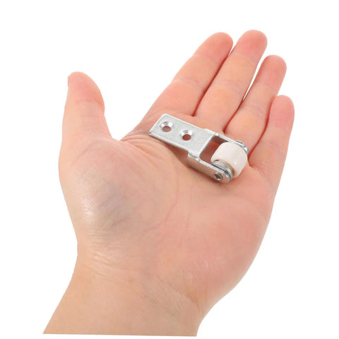 6 Pack Rock Solid Sliding Door Rollers With Galvanized Nylon Tracks For Cabinets And Furniture, hand holding small roller with metal bracket.
