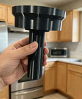 Professional Smoke Detector Removal Tool With A Slick Pole Attachment Gripper In Red, held in hand, kitchen background.