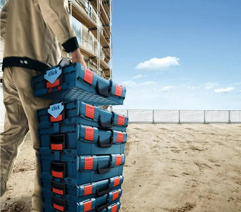 Person holding stack of blue and red organizers, part of 30 Piece Organizer Set For iBOXX72 Click And Go Mobile Transport System