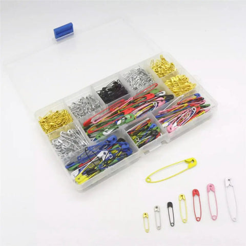 Kickass Assorted Steel Safety Pins Bulk Kit For Sewing Tailoring And Crafting colorful safety pins in a storage box.