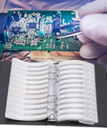 Top Tier 0402 Resistor Assortment Kit With 8500 Pieces And 170 Values in a labeled book beside a circuit board.