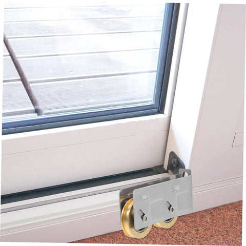 Close-up of Rock Solid Heavy Duty Double Wheel Sliding Door Pulley Two Pack stainless steel roller kit installed on patio door track.