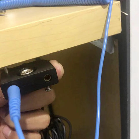 ESD grounding kit, black rectangular block with blue ground cord for ESD mat and wrist strap