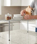 One Tier Steel Wire Shelving Unit With Adjustable Storage Rack Setup Measuring Thirty Inches By Fourteen Inches in kitchen use.
